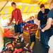 Ann Arbor resident Nate Wegryn, 17, shovels soggy fireworks into a bag held open by Carson Alexander-White, 18 and Oleg Lougheed, 19, as they work to clean up after storm damage at Jake's Fireworks on Thursday morning.  Melanie Maxwell I AnnArbor.com